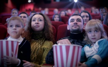 Stock Video Family Watching A Childrens Movie At The Cinema For PC