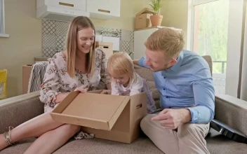 Stock Video Family Unpacking When Moving Into Their New Home For PC