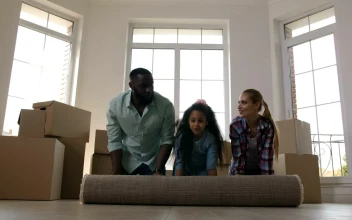 Stock Video Family Unrolling A New Carpet For PC