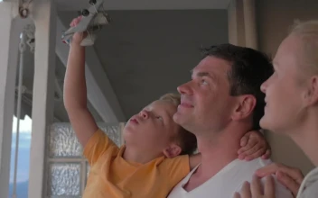 Stock Video Family Standing On A Hotel Balcony For PC