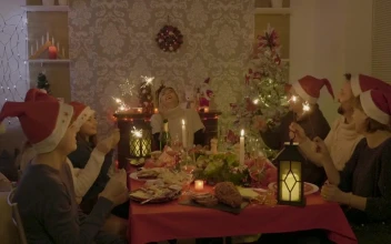 Stock Video Family Sings And Waves Sparklers At Holiday Dinner For PC