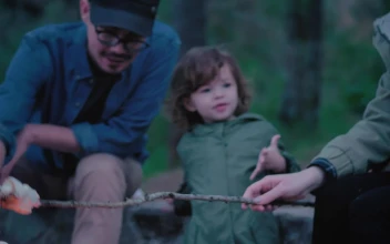 Stock Video Family Roasting Marshmallows Over A Campfire For PC