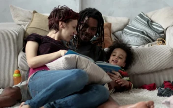 Stock Video Family Reading A Story On The Floor For PC