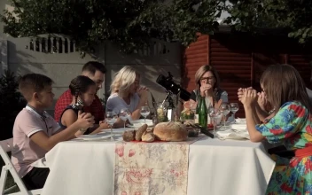Stock Video Family Praying Before The Meal In The Garden For PC