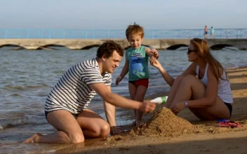 Stock Video Family Playing With Wet Sand For PC