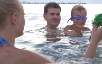 Stock Video Family Playing With A Toy In The Ocean For PC
