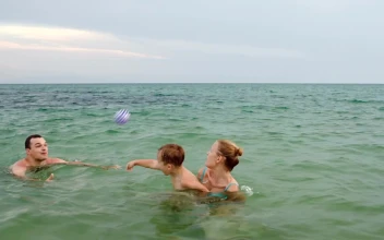 Stock Video Family Playing With A Ball In The Shore For PC