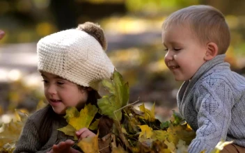 Stock Video Family Playing In The Autumn Leaves For PC