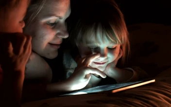 Stock Video Family Of Three Watching The Tablet In The Bedroom For PC