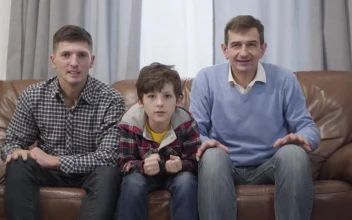 Stock Video Family Of Football Fans Cheer On Sofa Watching Game For PC