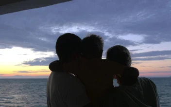 Stock Video Family Looking Out Over The Sea At Dusk For PC