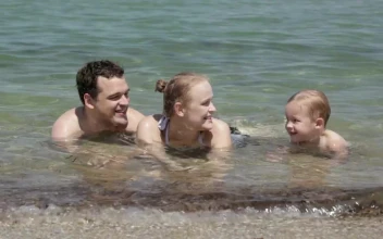 Stock Video Family Laying In The Ocean For PC