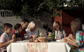 Stock Video Family In A Table Outdoors Praying Before The Meal For PC