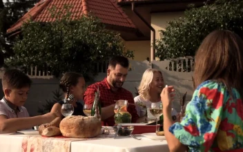 Stock Video Family Having Dinner In The Garden On A Sunny Day For PC