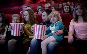 Stock Video Family Enjoying A Movie At The Cinema Medium Shot For PC