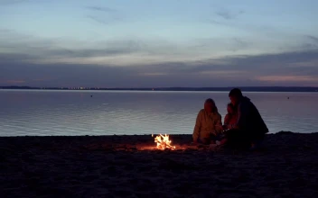 Stock Video Family Enjoying A Campfire At The Beach For PC