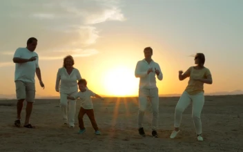 Stock Video Family Dancing At The Beach During Sunset For PC