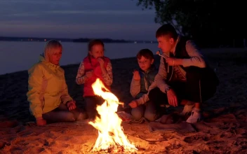 Stock Video Family Cooking Over A Campfire For PC