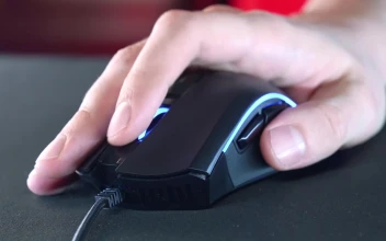 Stock Video Hand Scrolling And Moving A Gaming Mouse For PC
