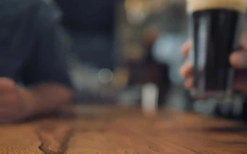 Stock Video Hand Putting A Glass Of Beer For PC