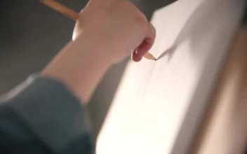 Stock Video Hand Of An Artist Drawing On A Canvas For PC