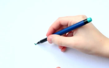 Stock Video Hand Of A Young Person Drawing A Family For PC