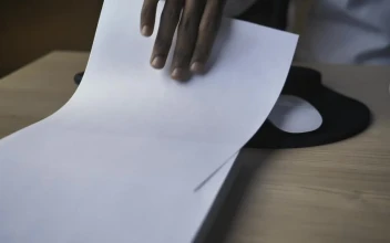Stock Video Hand Of A Person Taking A Blank Sheet Of Paper For PC