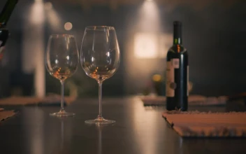 Stock Video Hand Of A Person Serving Wine In Two Glasses For PC