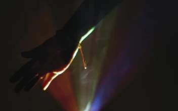 Stock Video Hand Of A Person In The Dark Through Colored Lights For PC