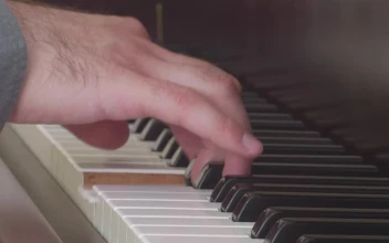 Stock Video Hand Of A Musician Playing The Keys Of A Piano For PC