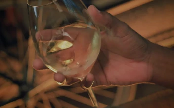 Stock Video Hand Of A Man Shaking Champagne From A Glass For PC