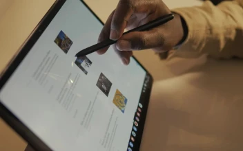 Stock Video Hand Of A Man Browsing The Internet On A Tablet For PC
