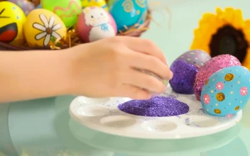 Stock Video Hand Of A Girl Decorating Easter Eggs For PC