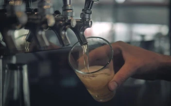 Stock Video Hand Of A Bartender Serving Beer For PC