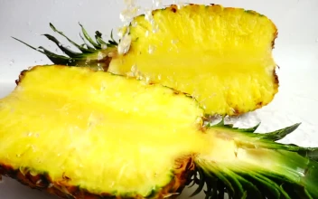 Stock Video Halved Pineapple Under A Tap For PC