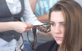 Stock Video Hairstylist Weaving A Bread In A Model For PC