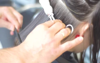 Stock Video Hairstylist Cutting Womans Hair With Fire For PC