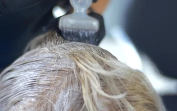 Stock Video Hairstylist Applying Hair Dye For PC
