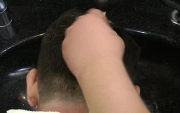 Stock Video Hairdresser Washing A Clients Hair For PC