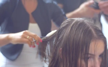 Stock Video Hairdresser Using Fire To Cut The Womans Hair For PC