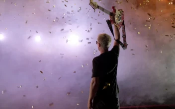 Stock Video Guitarist Raising His Guitar On A Smoky Stage For PC