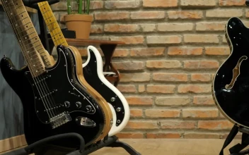 Stock Video Guitarist Takes An Electric Acoustic Guitar For PC