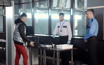 Stock Video Guard Inspecting A Passenger Bag At The Airport For PC