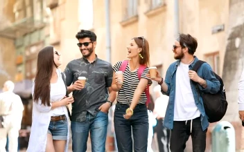 Stock Video Group Of Friends Walk On Street With Coffee For PC