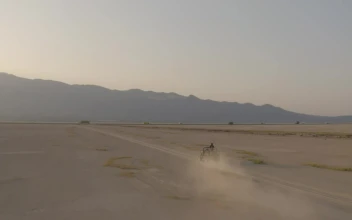 Stock Video Group Of Friends Traveling Through A Desert In An Aerial For PC