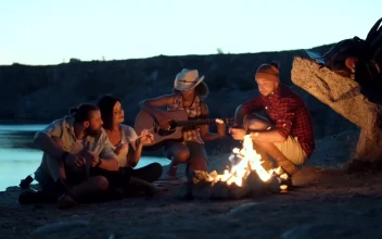 Stock Video Group Of Friends Singing Around The Campfire For PC