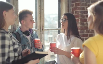 Stock Video Group Of Friends Share Drinks And Ideas By Window For PC