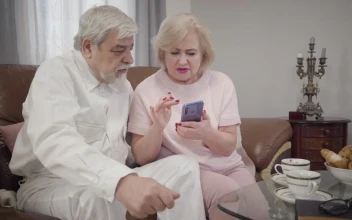 Stock Video Grandmother Teaches Her Husband How To Use A Phone For PC