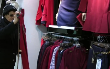 Stock Video Grandmother Shopping In A Clothing Store For PC