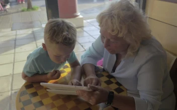 Stock Video Grandmother And Child Using A Tablet For PC